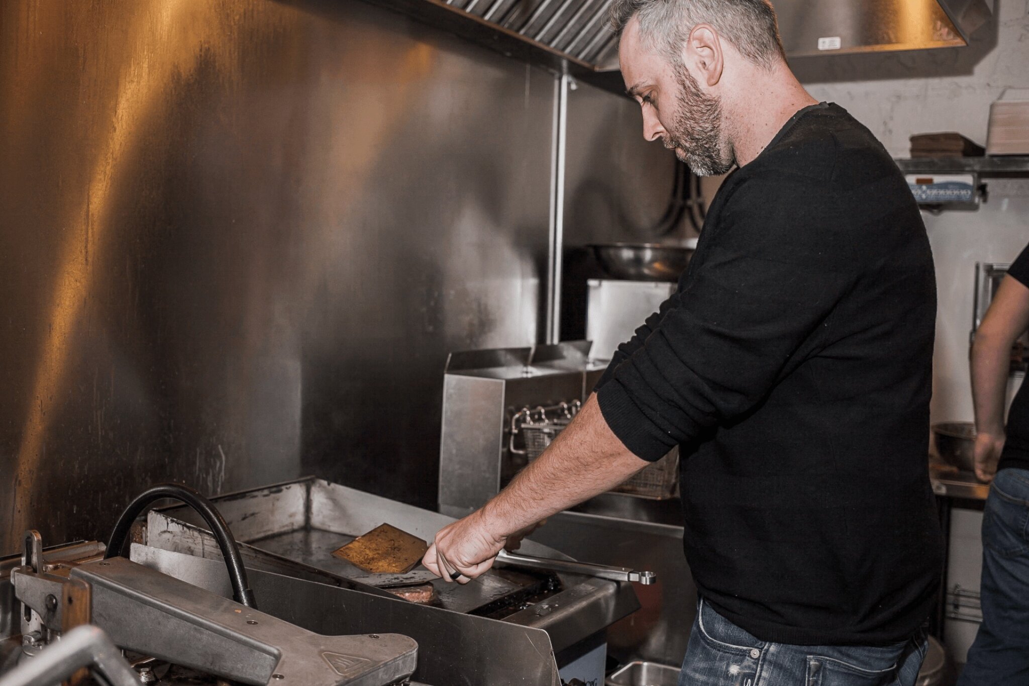 owner preparing food.