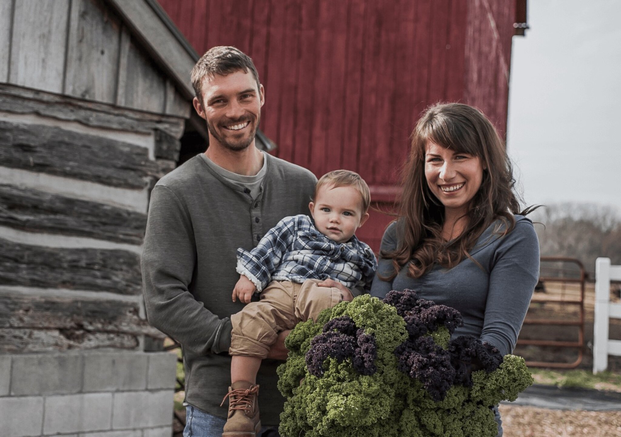 family holding kale.